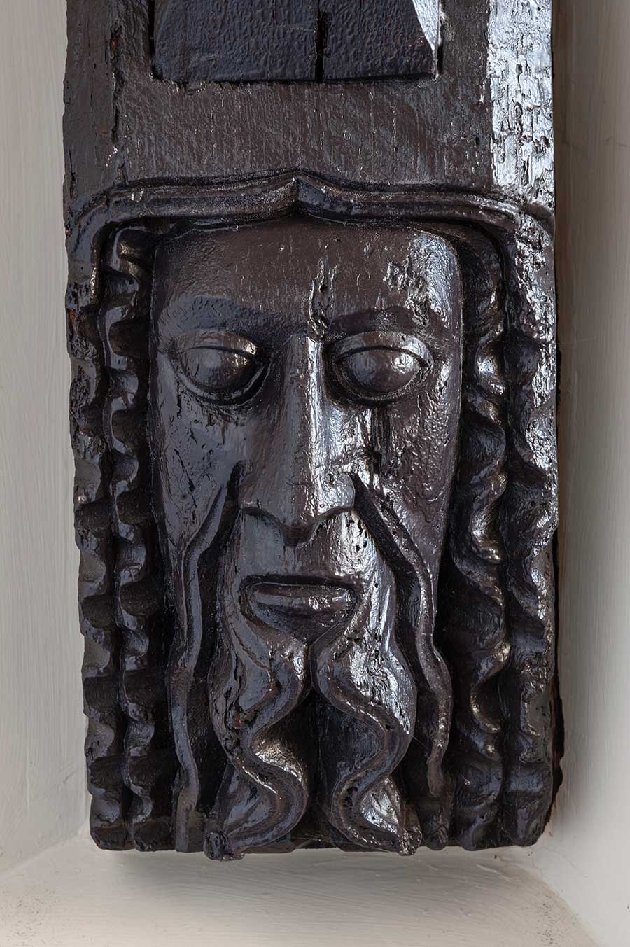 One of the carved heads supporting the chapel roof.